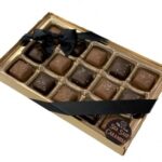 A premium box of 15 creamy caramels drenched in milk or dark chocolate and sprinkled with sea salt. +$24.99