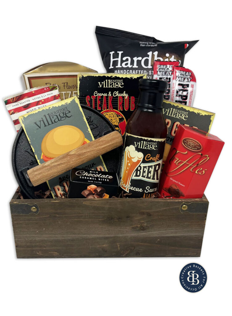 Seasonal BBQ gift basket in a wooden crate with a cast iron burger press, steak rub, craft beer barbecue sauce, pepperoni sticks and truffles